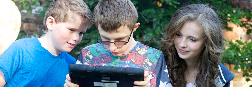 Image of young people using a tablet to Find a Service