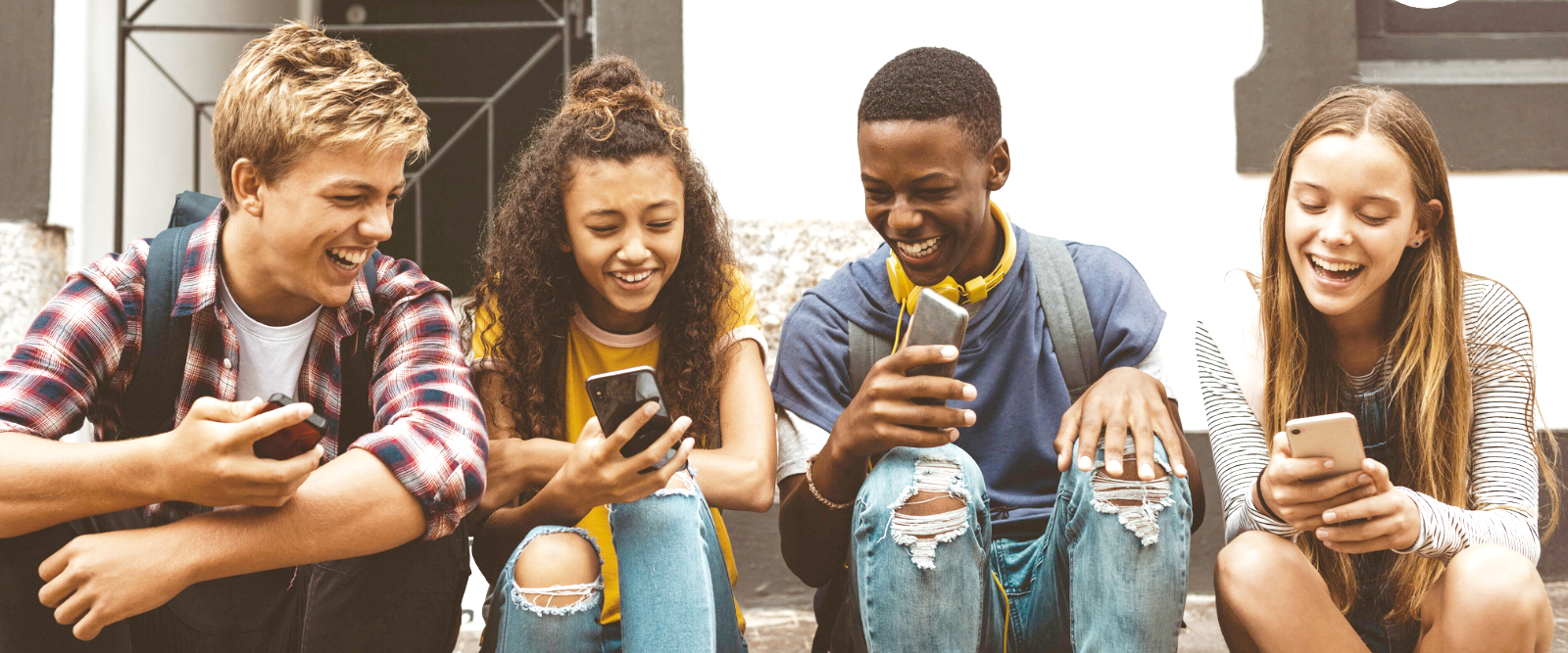 Young people on mobile phones.