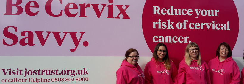 Staff in front of Jo's Trust Cervical Cancer Awareness Bus