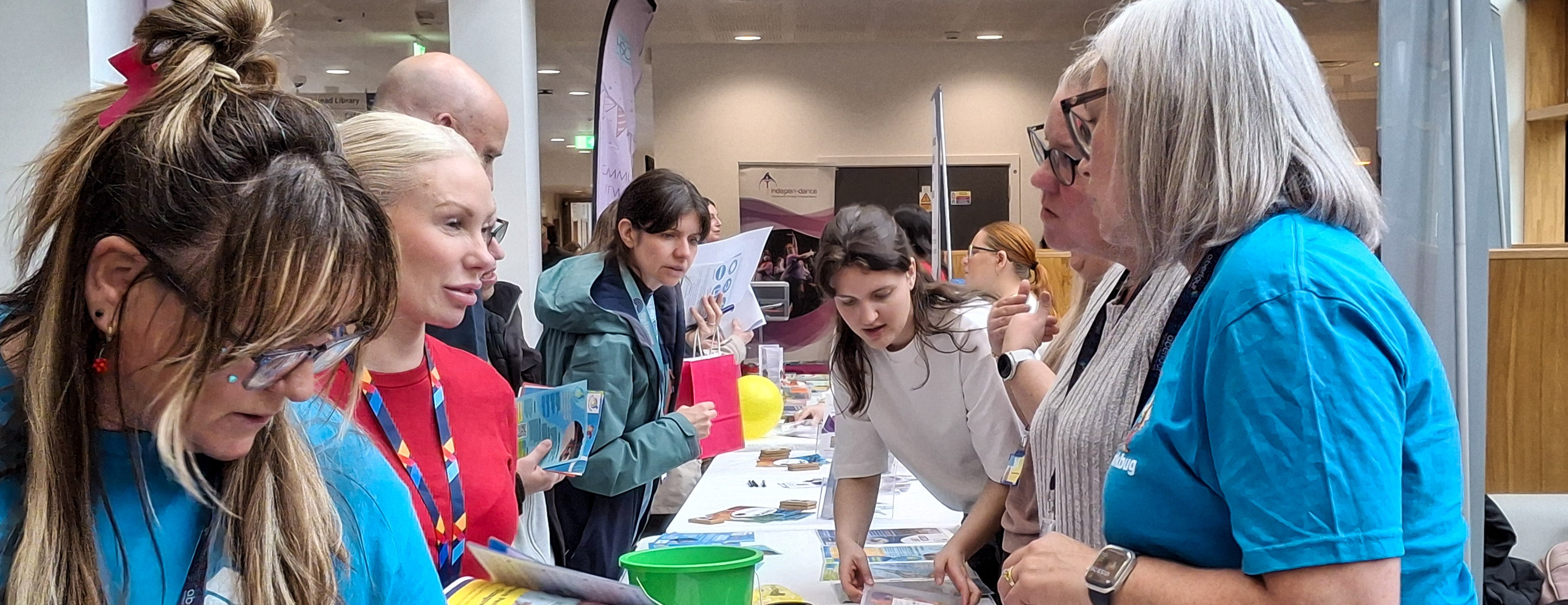 Stall holders talking to visitors at Parkhead Hub