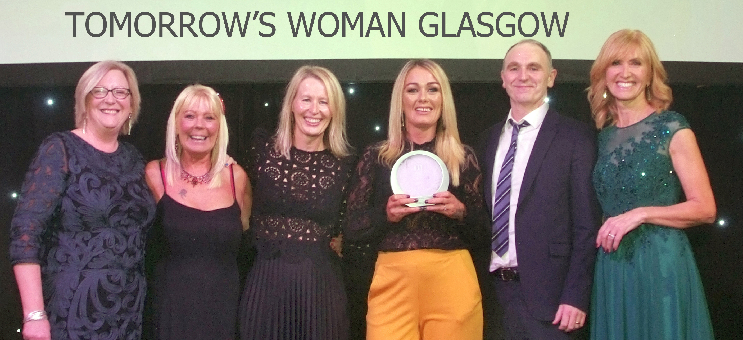 Staff from Tomorrow's Women with COSLA Chief Executive Sally Loudon (left) and host Jackie Bird (right).