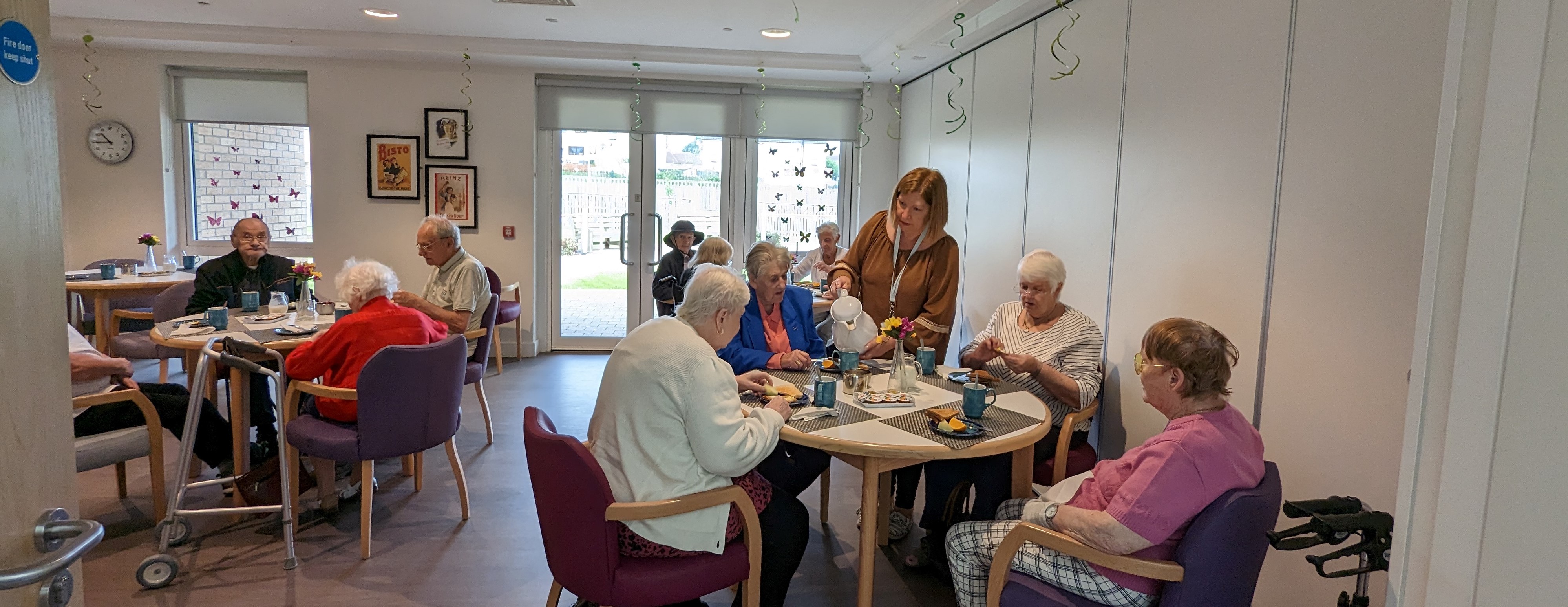 image of services users in the dining room of a day care centre